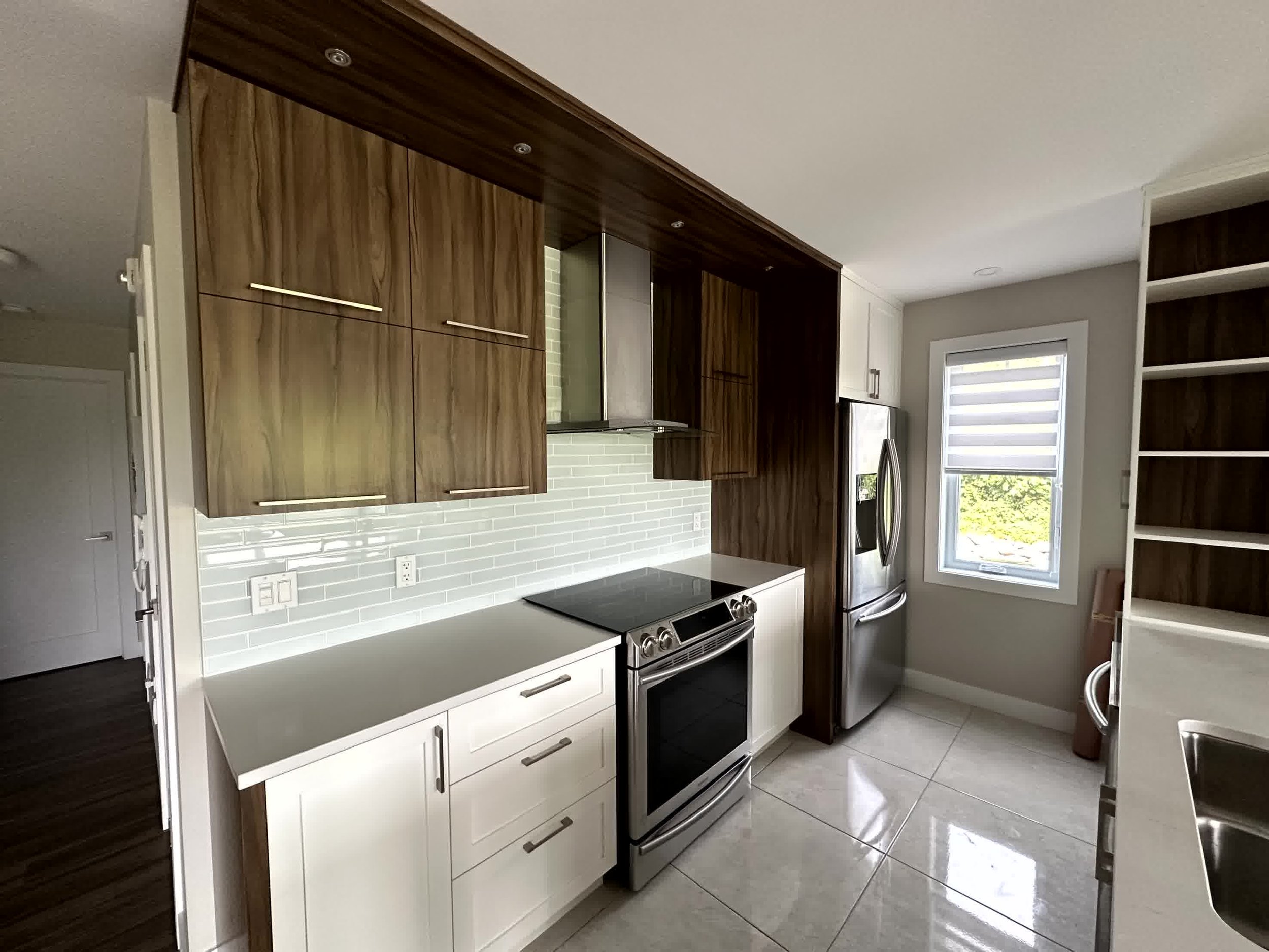 Kitchen refacing before and after: outdated oak cabinets transformed into a modern kitchen with clean lines